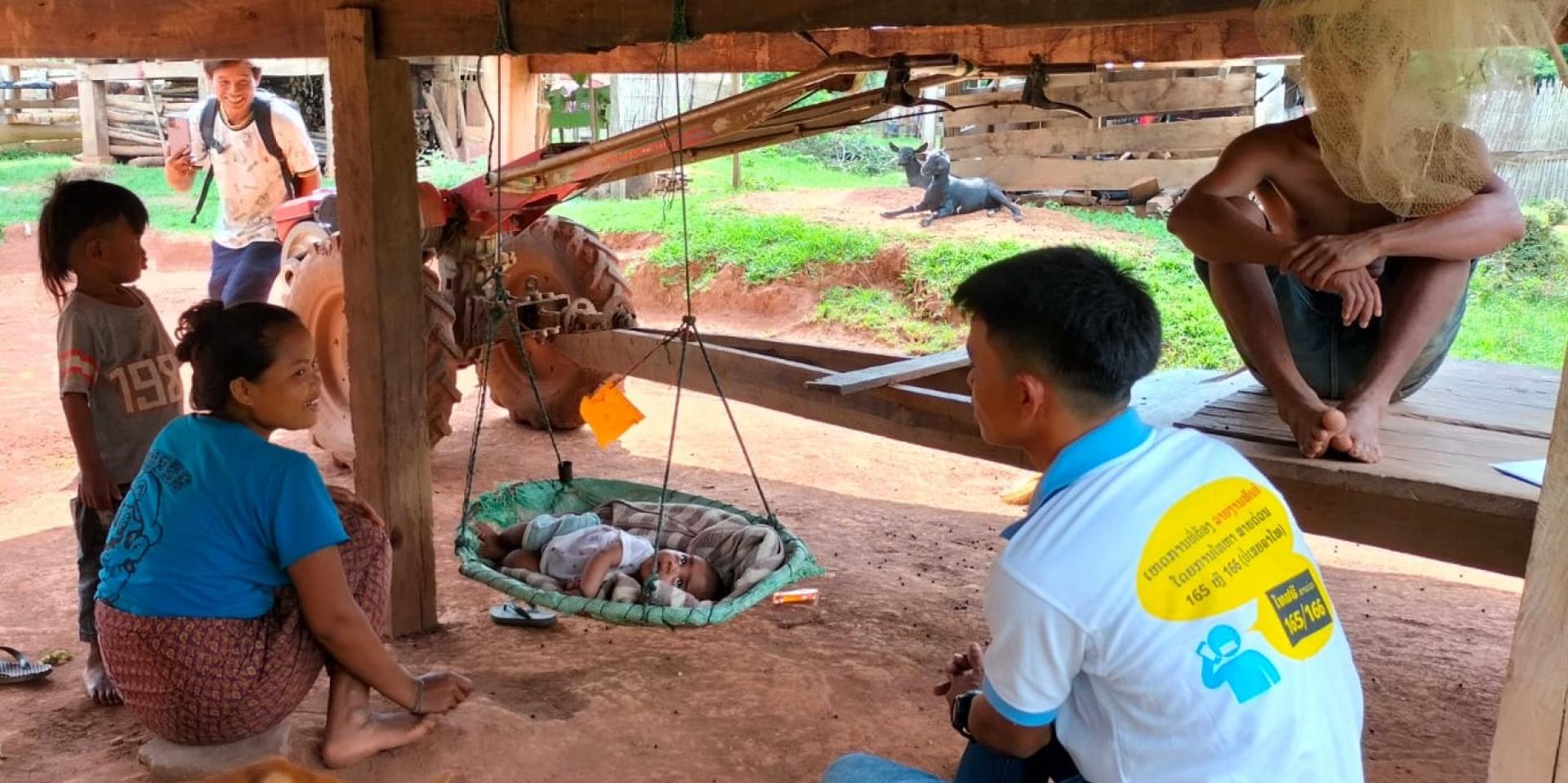 A village health volunteer provides essential newborn care guidance and primary health care advice during a home visit to a new mother. Photo: HPA