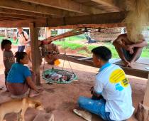 A village health volunteer provides essential newborn care guidance and primary health care advice during a home visit to a new mother. Photo: HPA