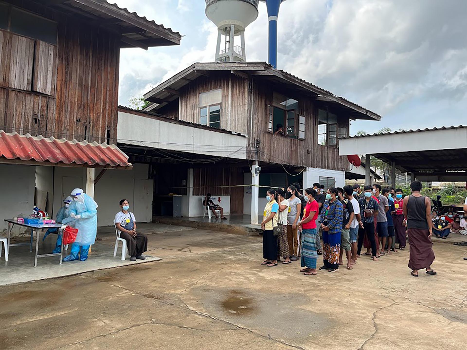 Local health authorities providing COVID-19 antigen testing for migrants outside the temporary detention centre. Photo: Malaria Free Mekong - ALIGHT