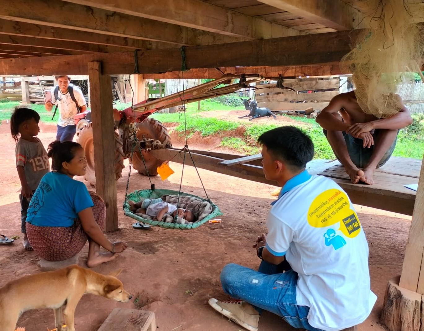 A village health volunteer provides essential newborn care guidance and primary health care advice during a home visit to a new mother. Photo: HPA