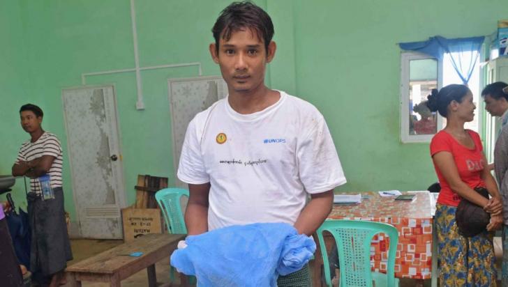 Madauk village integrated community malaria volunteer U Nyi Nyi Aung is ready to distribute LLINs free of charge to villagers. Photo: UNOPS