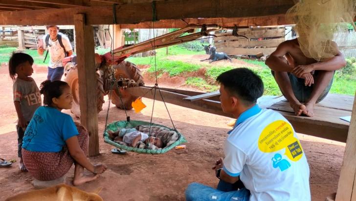 A village health volunteer provides essential newborn care guidance and primary health care advice during a home visit to a new mother. Photo: HPA